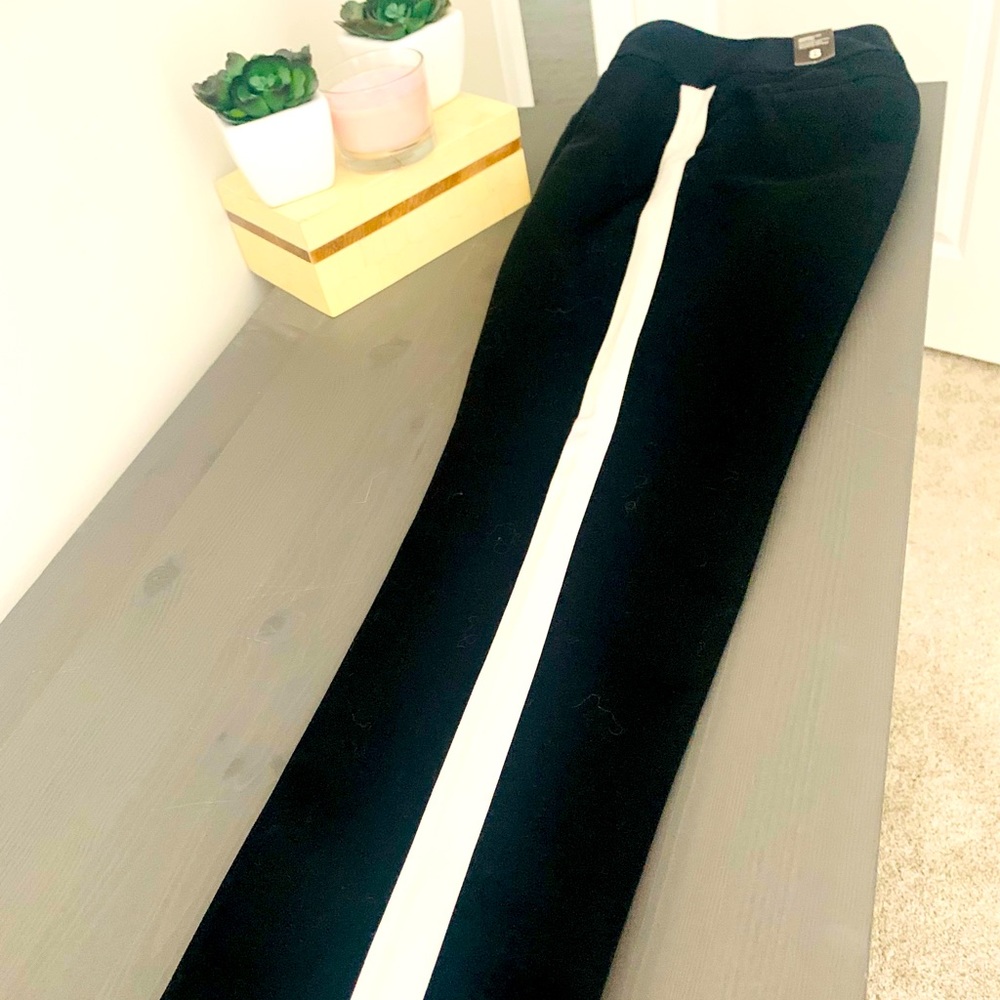 Slim, size 8 black slacks with white on side. New with tags from The Limited.